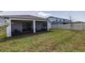 Spacious backyard with a screened-in lanai, perfect for outdoor entertaining and relaxation at 4012 Meandering Bay Dr, Apopka, FL 32712