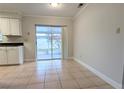 Bright kitchen nook area featuring sliding glass doors, easy access to the outdoor screened patio at 479 Little Aspen Ct, Ocoee, FL 34761