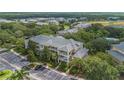 Aerial view of a lovely condo community showcasing its multiple floors and convenient parking at 107 Rum Run # 107, Davenport, FL 33897