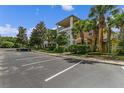 Condo exterior with a well-kept lawn and parking area, enhancing curb appeal at 107 Rum Run # 107, Davenport, FL 33897