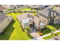 Aerial view of a beautiful single-story home with lush green lawn and professional landscaping at 12334 Upper Harden Ave, Orlando, FL 32827