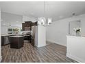 Open-concept dining area connected to a kitchen with stainless steel appliances at 236 Elm Ct, Kissimmee, FL 34759