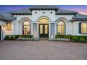 Close up of the home's entryway with double doors, brick walkway, and beautifully maintained landscaping at 3382 Fernlake Pl, Longwood, FL 32779
