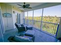 The lanai features comfortable seating and a ceiling fan with calming views of the surrounding nature at 5300 S Atlantic Ave # 4-302, New Smyrna Beach, FL 32169