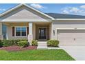 Charming home featuring manicured landscaping, an inviting entrance, and well-maintained exterior at 5829 Valentino Way, Lakeland, FL 33812