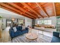Bright living room showcasing wood-beam ceilings, and an open layout with inviting natural light at 605 Ensenada Dr, Orlando, FL 32825