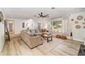 Bright living room features neutral walls, hardwood flooring, large windows and ample natural light at 605 Ensenada Dr, Orlando, FL 32825