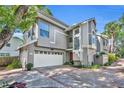 Stylish two-story townhouse showcasing a well-manicured yard and inviting curb appeal at 796 Mcintyre Ave, Winter Park, FL 32789