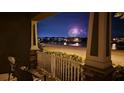 Charming porch view of lake with gorgeous fireworks display on a lovely night in the neighborhood at 8643 Coventry Park Way, Windermere, FL 34786
