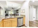 Modern kitchen featuring granite countertops, stainless steel appliances, and an open floor plan at 9051 Treasure Trove Ln # 405, Kissimmee, FL 34747