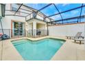 Relaxing screened-in pool area with lounge chairs for enjoying the Florida sun at 1571 Plunker Dr, Davenport, FL 33896