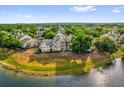 Lakeside condo complex nestled among lush greenery and mature trees at 1065 S Hiawassee Rd # 1436, Orlando, FL 32835