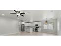Spacious open layout with recessed lighting, new stainless steel appliances, and white cabinets at 1440 Lake Shore Dr, Casselberry, FL 32707