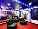 Themed media room with comfortable seating and Star Wars-themed decor, perfect for movie nights and entertainment at 1491 Rolling Fairway Dr, Davenport, FL 33896
