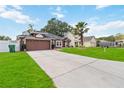 A nicely maintained home with a basketball hoop and ample parking space in a quiet neighborhood at 18 Cooledge St, Winter Garden, FL 34787