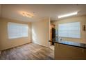 Dining room with lots of natural light and hardwood floors at 2586 Robert Trent Jones Dr # 1116, Orlando, FL 32835