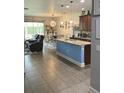Well-equipped kitchen with an island, pendant lights, and stainless appliances at 2667 River Landing Dr, Sanford, FL 32771