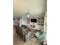 Living room showcases built-in shelving, ceiling fan, and comfortable seating area at 2667 River Landing Dr, Sanford, FL 32771