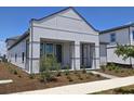 Modern home featuring professionally landscaped yard and unique front architecture at 2976 Embark Trail, St Cloud, FL 34771