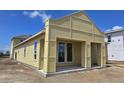 New construction home featuring large windows, covered porch, and modern architectural details at 2976 Embark Trail, St Cloud, FL 34771