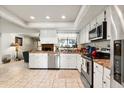 Bright kitchen with stainless steel appliances, ample cabinet space, and tile flooring at 400 Woodview Dr, Longwood, FL 32779