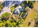 Aerial view of a single Gathering home featuring well-maintained landscaping at 516 Sanctuary Golf Pl, Apopka, FL 32712