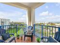 Relaxing balcony offers scenic views and comfortable seating at 5300 S Atlantic Ave # 2-501, New Smyrna Beach, FL 32169