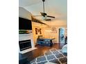Bright dining area with hardwood floors, a farmhouse style table, and decorative lighting fixtures at 651 Holbrook Cir, Lake Mary, FL 32746