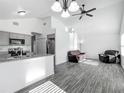 Open-concept living space showcasing a seamless blend of the kitchen, dining area, and living room at 12388 Se 106Th Ave, Belleview, FL 34420