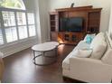 Inviting living room showcasing natural light and a stylish media center at 1474 Thornhill Cir, Oviedo, FL 32765