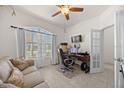 Inviting office with a comfortable sofa, desk, and plenty of natural light, creating a productive workspace at 2380 Kaley Ridge Rd, Clermont, FL 34715