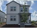 Charming two-story home with gray siding and welcoming front porch at 2963 Embark Trail, St Cloud, FL 34771