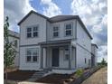 Attractive two-story home with gray siding and classic architectural details at 2963 Embark Trail, St Cloud, FL 34771