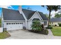 Attractive single-Gathering home with a well-maintained lawn, two-car garage, and mature landscaping at 30746 Fairview Ave, Tavares, FL 32778