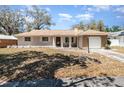 Charming home with a well-maintained front yard and covered entryway at 4723 Cherokee Rose Dr, Orlando, FL 32808