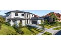 Beautiful view of the home, showcasing its gray stone driveway and manicured lawn at 5762 Emerington Cres, Orlando, FL 32819