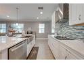 Spacious modern kitchen with stainless steel appliances and a center island at 6667 Alder Rd, Harmony, FL 34773