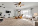 Inviting living room featuring a whitewashed brick wall, large window, and cozy seating area at 825 Second St, Orange City, FL 32763