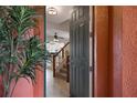 Open foyer with tiled floor, view of living spaces, and staircase leading to the upper level at 9478 Silver Buttonwood St, Orlando, FL 32832