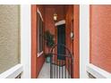 Welcoming front porch with decorative shutters, planter, and gated entry to the home at 9478 Silver Buttonwood St, Orlando, FL 32832