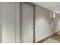 Hallway entrance to unit features a neutral color scheme and is equipped with a fire extinguisher at 150 E Robinson St # 2506, Orlando, FL 32801