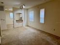 Bright living room boasts neutral tones, large windows, and ample natural light at 107 Vista Verdi Cir # 121, Lake Mary, FL 32746
