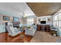Comfortable living room featuring a fireplace, built-in desk, and ample natural light from shuttered windows at 1000 E Anderson St, Orlando, FL 32801