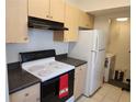 Well-equipped kitchen with modern appliances, ample counter space, and a convenient laundry area at 1021 Siena Park E Blvd # 301, Celebration, FL 34747