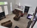 Bright and airy living room with vaulted ceilings, comfortable seating, and easy access to the bedroom at 1021 Siena Park E Blvd # 301, Celebration, FL 34747