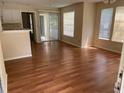 Living room with laminate flooring and sliding glass doors that let in plenty of natural light at 1089 S Hiawassee Rd # 314, Orlando, FL 32835