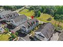 Aerial view showcases the townhome complex nestled in a well-designed community at 1123 Mahonia Ct, Lake Mary, FL 32746
