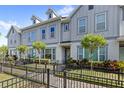 Stylish townhome featuring well-maintained landscaping and a welcoming entrance at 1123 Mahonia Ct, Lake Mary, FL 32746