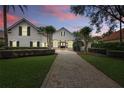 Charming two-story home featuring a paver driveway and professional landscaping at 11345 Preserve View Dr, Windermere, FL 34786