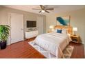 Cozy bedroom featuring a comfortable bed, TV, and stylish decor at 1912 Cattleya Dr, Kissimmee, FL 34741